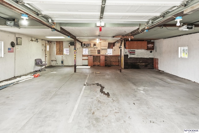 1107 E 1st St, Fremont, NE 68025 - garage featuring a garage door opener and a workshop area