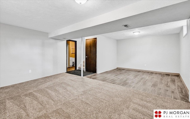 14030 Orchard Ave, Omaha, NE 68137 - unfurnished room featuring a textured ceiling and wood finished floors