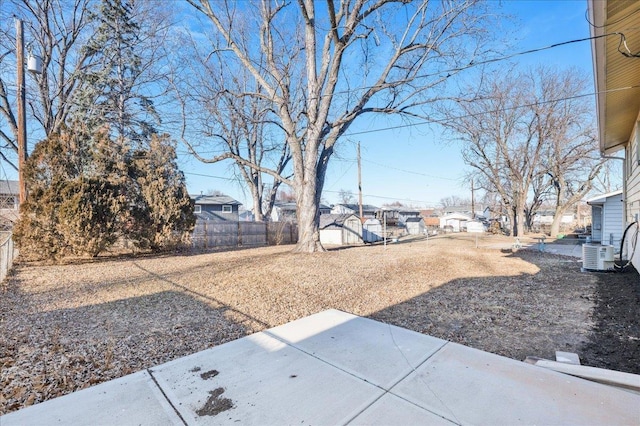 14030 Orchard Ave, Omaha, NE 68137 - fenced backyard featuring a patio area, a residential view, and a storage unit