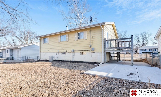 14030 Orchard Ave, Omaha, NE 68137 - rear view of house with a patio and a wooden deck