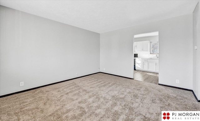 14030 Orchard Ave, Omaha, NE 68137 - carpeted empty room featuring baseboards