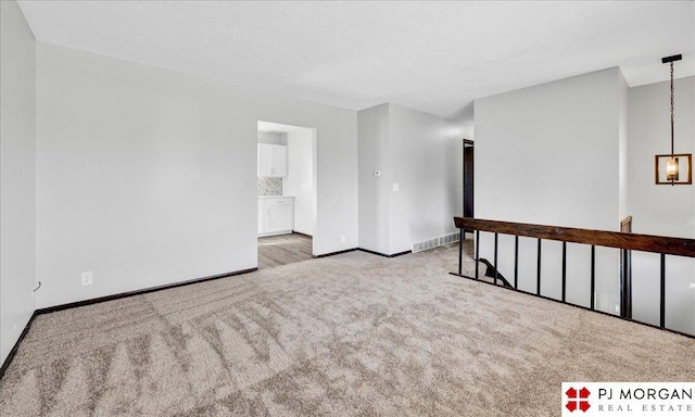 14030 Orchard Ave, Omaha, NE 68137 - carpeted empty room featuring baseboards