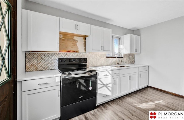 14030 Orchard Ave, Omaha, NE 68137 - kitchen featuring black electric range, decorative backsplash, and white cabinets