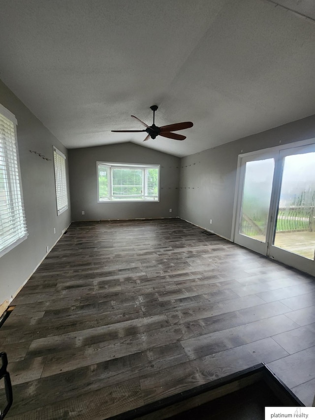 5020 N 106th St, Omaha, NE 68134 - unfurnished room with vaulted ceiling, a ceiling fan, dark wood-style flooring, and a textured ceiling