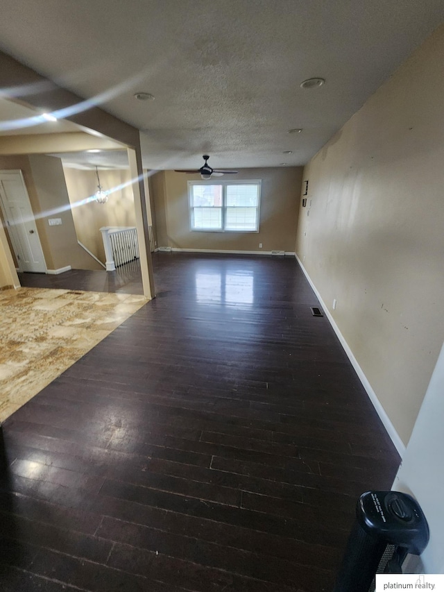5020 N 106th St, Omaha, NE 68134 - unfurnished living room with hardwood / wood-style floors, a ceiling fan, and a textured ceiling