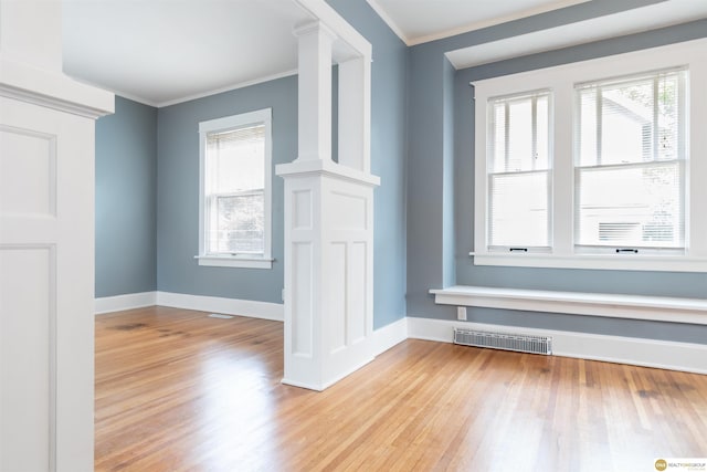 3207 Castelar St, Omaha, NE 68105 - entrance foyer with wood finished floors, crown molding, and ornate columns
