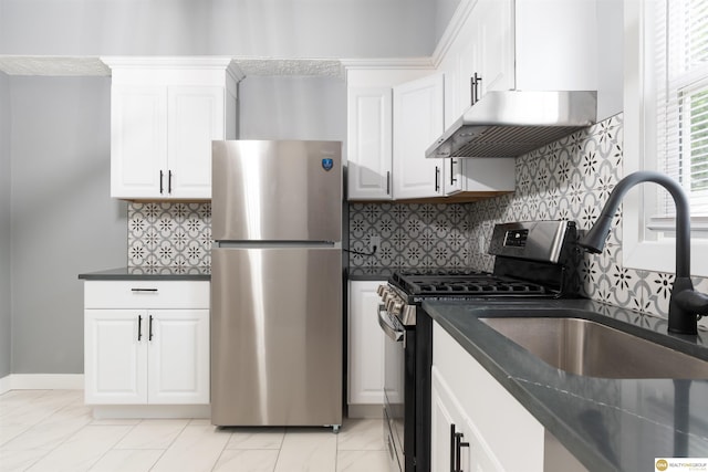 3207 Castelar St, Omaha, NE 68105 - kitchen with stainless steel appliances, dark countertops, range hood, and white cabinetry