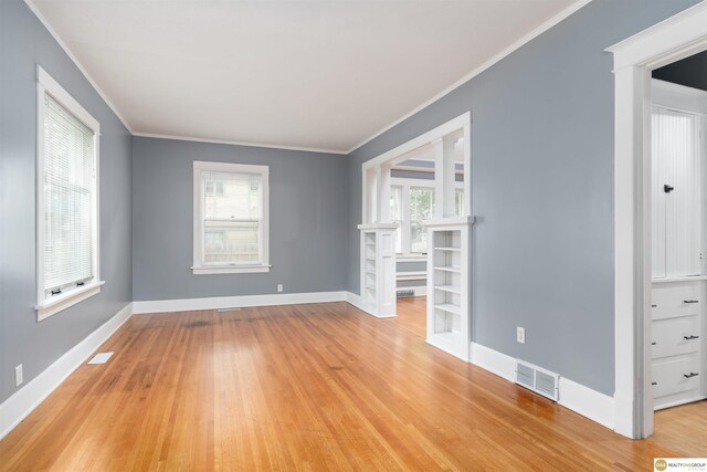 3207 Castelar St, Omaha, NE 68105 - spare room featuring ornamental molding and light wood-style flooring