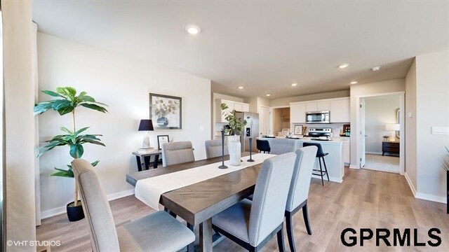 11470 Port Royal Dr, Papillion, NE 68046 - dining area with light wood-style floors and recessed lighting