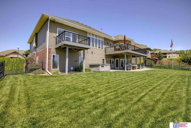 223 N Lakeview Way, Ashland, NE 68003 - back of property featuring a hot tub, a balcony, a fenced backyard, a patio, and brick siding