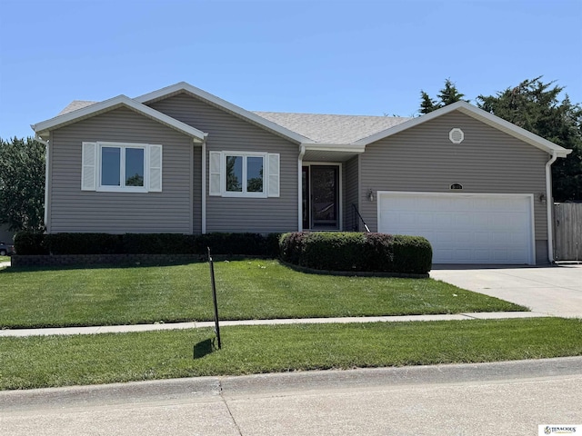 5001 W Sparrow Ln, Lincoln, NE 68528 - ranch-style home with concrete driveway, a garage, and a front yard