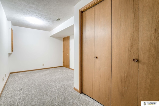 5001 W Sparrow Ln, Lincoln, NE 68528 - finished below grade area with light colored carpet and a textured ceiling