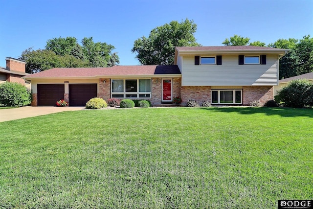 2204 Bramblewood Ln, Fremont, NE 68025 - split level home with a garage, brick siding, a front lawn, and driveway