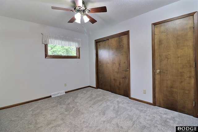 2204 Bramblewood Ln, Fremont, NE 68025 - unfurnished bedroom featuring carpet floors, a closet, and a ceiling fan