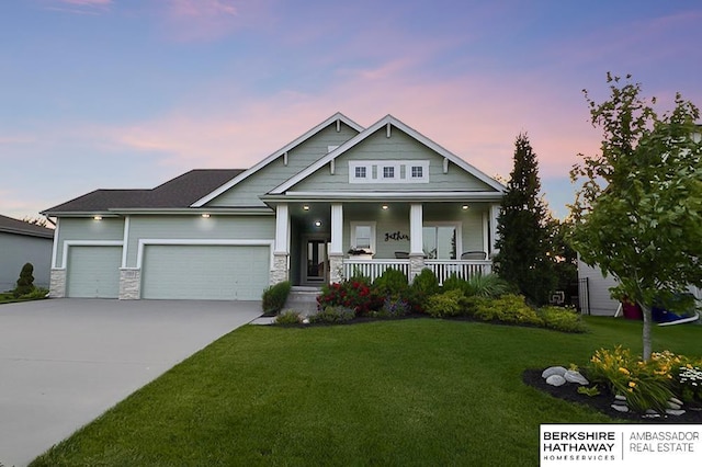 10818 S 109th St, Papillion, NE 68046 - craftsman-style home featuring a porch, an attached garage, a front lawn, driveway, and stone siding