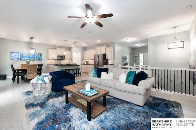 10818 S 109th St, Papillion, NE 68046 - living room featuring ceiling fan, light wood-style flooring, and recessed lighting