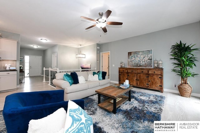 10818 S 109th St, Papillion, NE 68046 - living room featuring a ceiling fan and light wood-type flooring