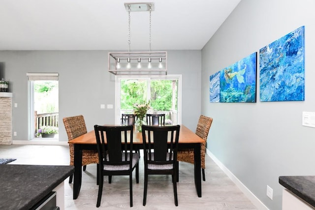 10818 S 109th St, Papillion, NE 68046 - dining space with light wood-type flooring and baseboards