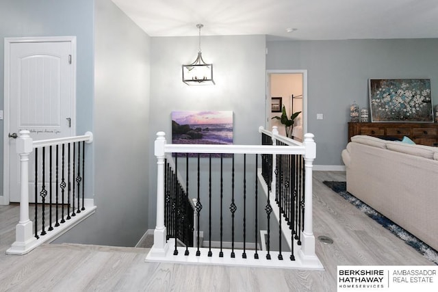 10818 S 109th St, Papillion, NE 68046 - staircase featuring wood finished floors and a chandelier