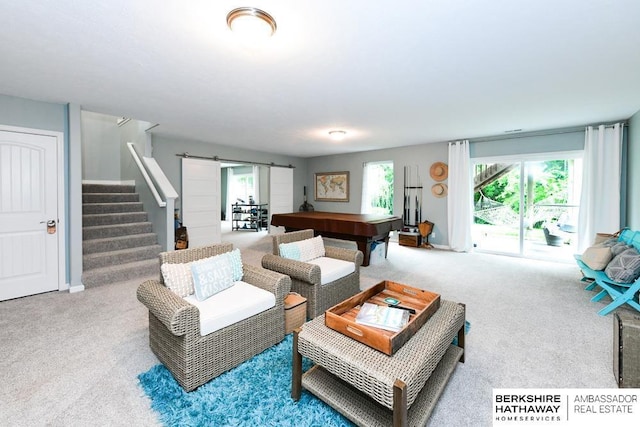 10818 S 109th St, Papillion, NE 68046 - living area with a barn door, carpet, stairs, and plenty of natural light