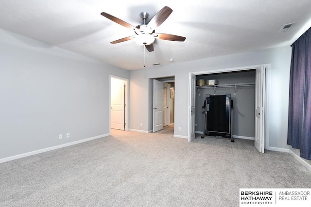 10818 S 109th St, Papillion, NE 68046 - unfurnished bedroom featuring a closet, light colored carpet, and a ceiling fan