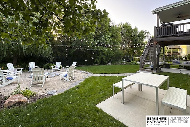 10818 S 109th St, Papillion, NE 68046 - view of yard featuring stairs, a patio, a ceiling fan, and an outdoor fire pit