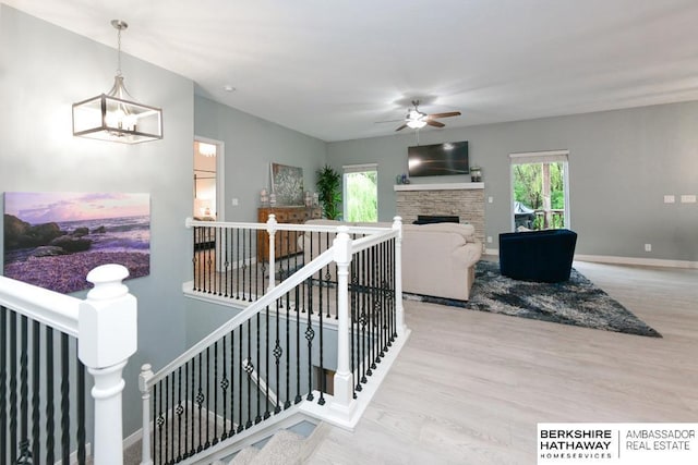 10818 S 109th St, Papillion, NE 68046 - stairs featuring healthy amount of natural light, a ceiling fan, and wood finished floors