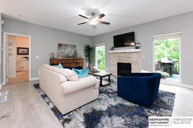 10818 S 109th St, Papillion, NE 68046 - living area featuring wood finished floors, ceiling fan, and a fireplace