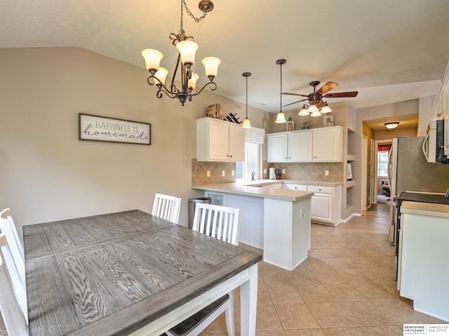 6015 S 163rd Cir, Omaha, NE 68135 - kitchen featuring tasteful backsplash, ceiling fan, white cabinetry, a peninsula, and light tile patterned floors