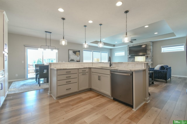 5017 N 209th St, Elkhorn, NE 68022 - kitchen featuring dishwasher, open floor plan, a tray ceiling, ceiling fan, and recessed lighting