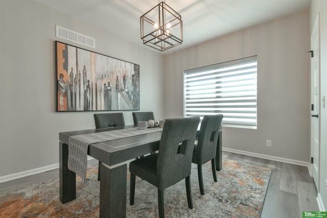 5017 N 209th St, Elkhorn, NE 68022 - dining space featuring a chandelier and wood finished floors