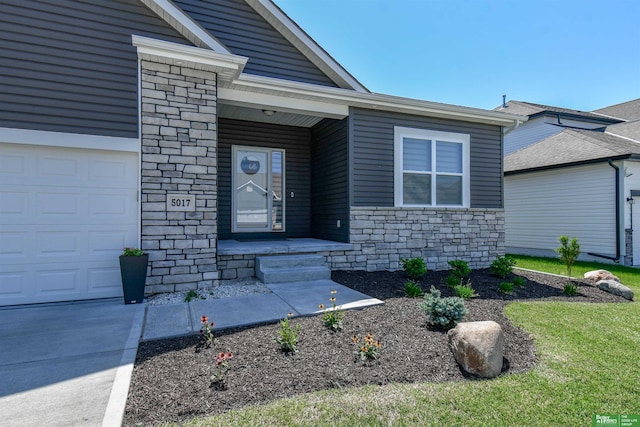 5017 N 209th St, Elkhorn, NE 68022 - property entrance featuring stone siding and a garage