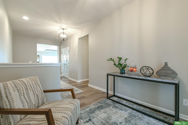 5017 N 209th St, Elkhorn, NE 68022 - living area featuring wood finished floors, a chandelier, and recessed lighting