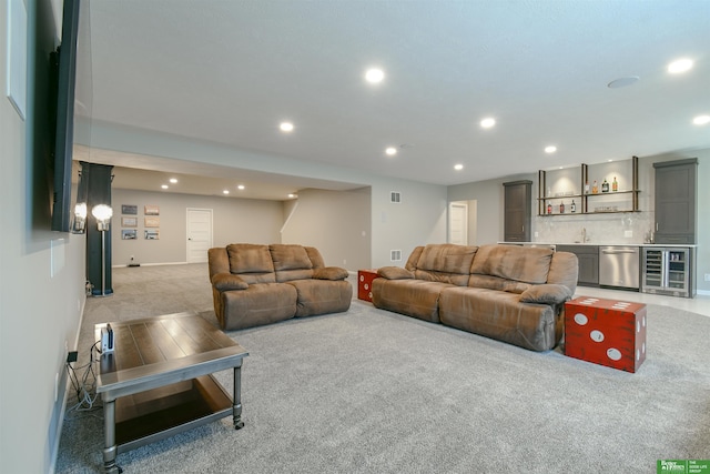 5017 N 209th St, Elkhorn, NE 68022 - living area featuring wine cooler, light carpet, wet bar, and recessed lighting