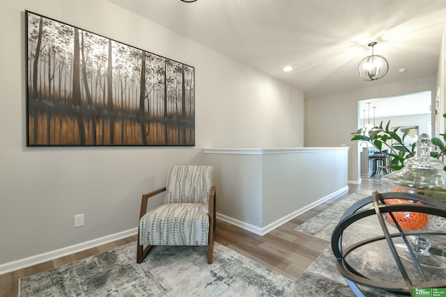 5017 N 209th St, Elkhorn, NE 68022 - sitting room with wood finished floors, recessed lighting, and a chandelier