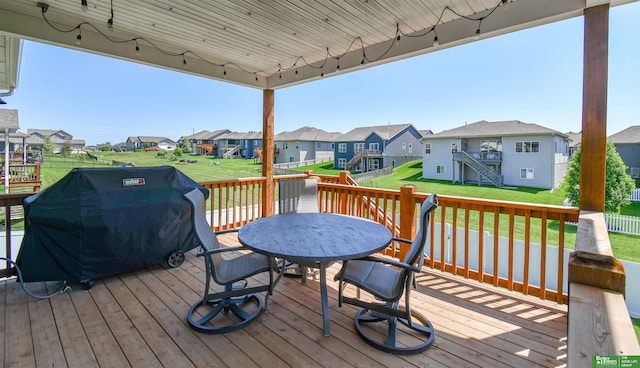 5017 N 209th St, Elkhorn, NE 68022 - wooden terrace with a residential view, area for grilling, outdoor dining space, and stairway