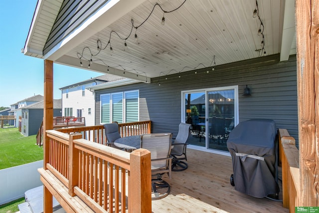 5017 N 209th St, Elkhorn, NE 68022 - deck featuring outdoor dining space, a grill, and a lawn