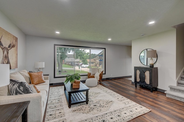 11680 Meredith Ave, Omaha, NE 68164 - living room with wood finished floors, stairs, and recessed lighting