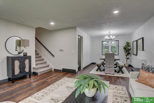11680 Meredith Ave, Omaha, NE 68164 - living area with a chandelier, a textured ceiling, wood finished floors, stairs, and recessed lighting