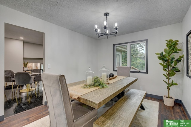11680 Meredith Ave, Omaha, NE 68164 - dining room featuring a chandelier, wood finished floors, and a textured ceiling