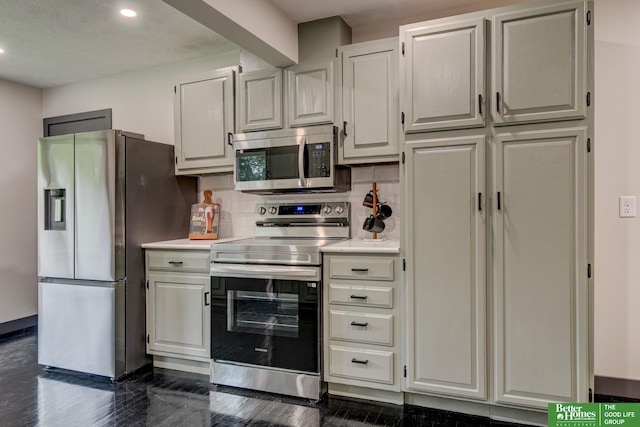 11680 Meredith Ave, Omaha, NE 68164 - kitchen with appliances with stainless steel finishes, light countertops, recessed lighting, and white cabinetry