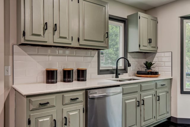 11680 Meredith Ave, Omaha, NE 68164 - kitchen featuring dishwasher, healthy amount of natural light, light countertops, and tasteful backsplash