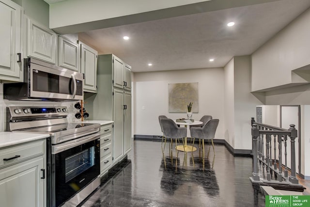 11680 Meredith Ave, Omaha, NE 68164 - kitchen with appliances with stainless steel finishes, recessed lighting, and light countertops