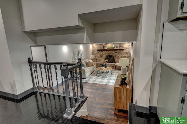 11680 Meredith Ave, Omaha, NE 68164 - staircase featuring wood finished floors and a brick fireplace