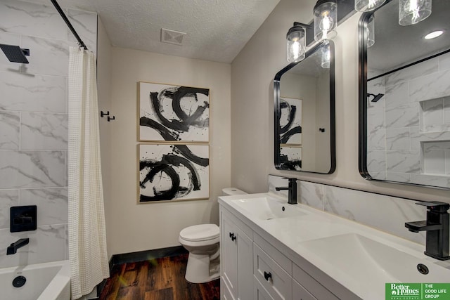 11680 Meredith Ave, Omaha, NE 68164 - bathroom featuring wood finished floors, double vanity, shower / bath combo, and a textured ceiling