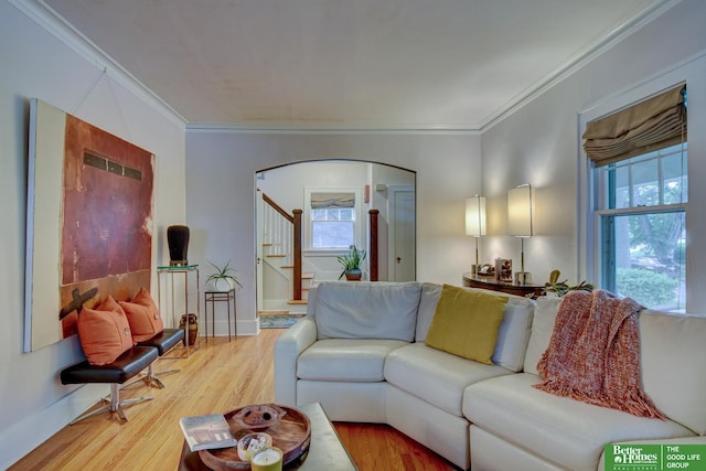 526 S 51st Ave, Omaha, NE 68132 - living room with arched walkways, crown molding, light wood-style floors, and stairway