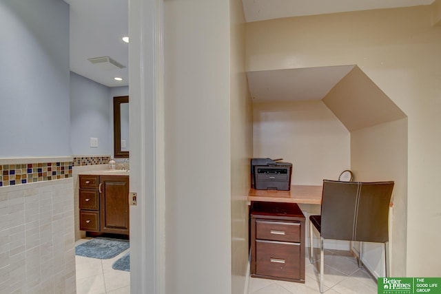 526 S 51st Ave, Omaha, NE 68132 - office featuring light tile patterned flooring, tile walls, recessed lighting, and a wainscoted wall
