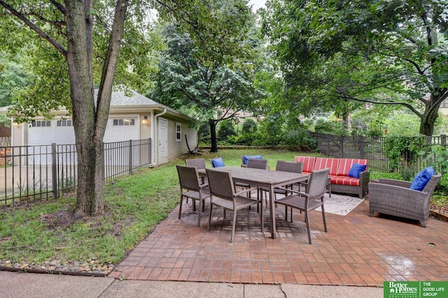 526 S 51st Ave, Omaha, NE 68132 - fenced backyard featuring a patio, an outdoor living space, a garage, and outdoor dining area