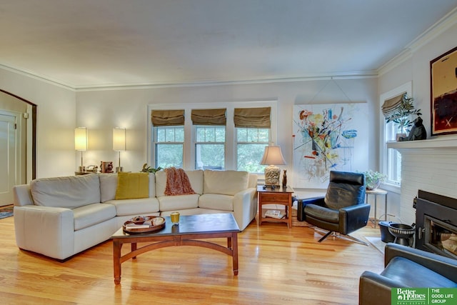 526 S 51st Ave, Omaha, NE 68132 - living room with light wood-style flooring, ornamental molding, and a brick fireplace