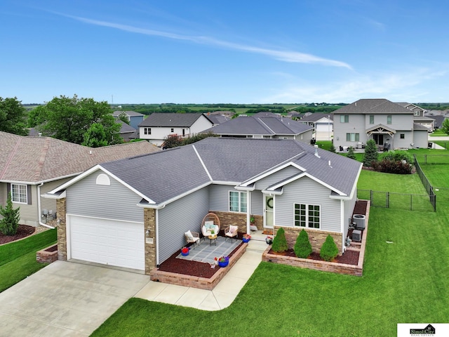 1015 Ridge Rd, Hickman, NE 68372 - view of front of house featuring a residential view, concrete driveway, an attached garage, brick siding, and roof with shingles